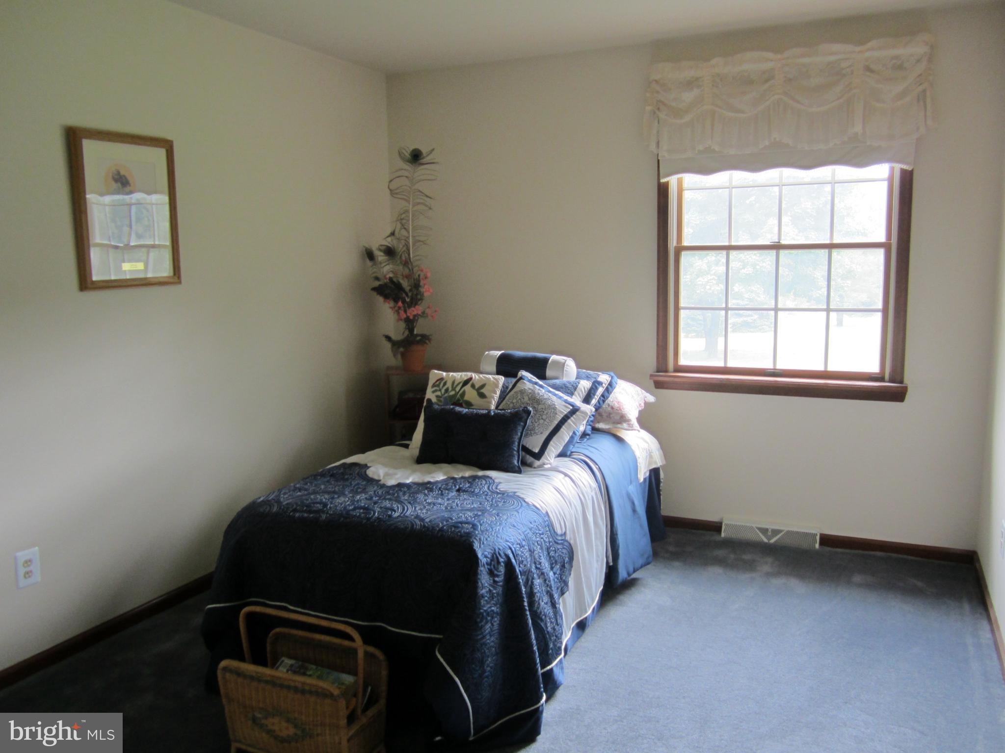 348 Eayrestown Road Southampton, NJ 08088 - Photo 15 of 32 a bedroom with a bed and a window