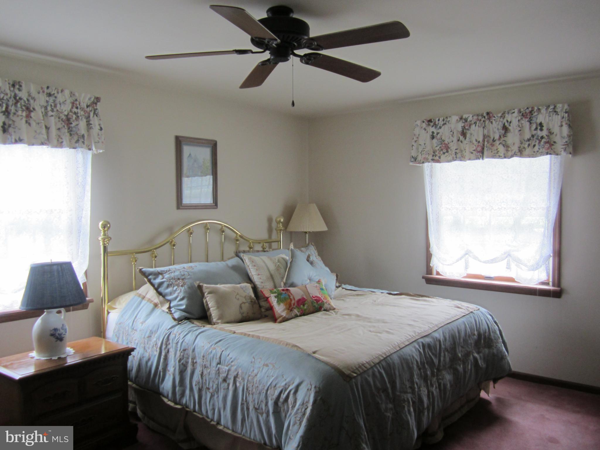 348 Eayrestown Road Southampton, NJ 08088 - Photo 18 of 32 a bedroom with a bed and a window