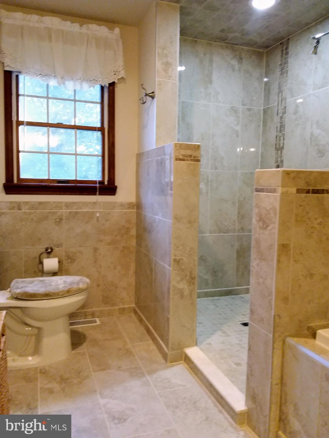 348 Eayrestown Road Southampton, NJ 08088 - Photo 19 of 32 a bathroom with a toilet sink and shower