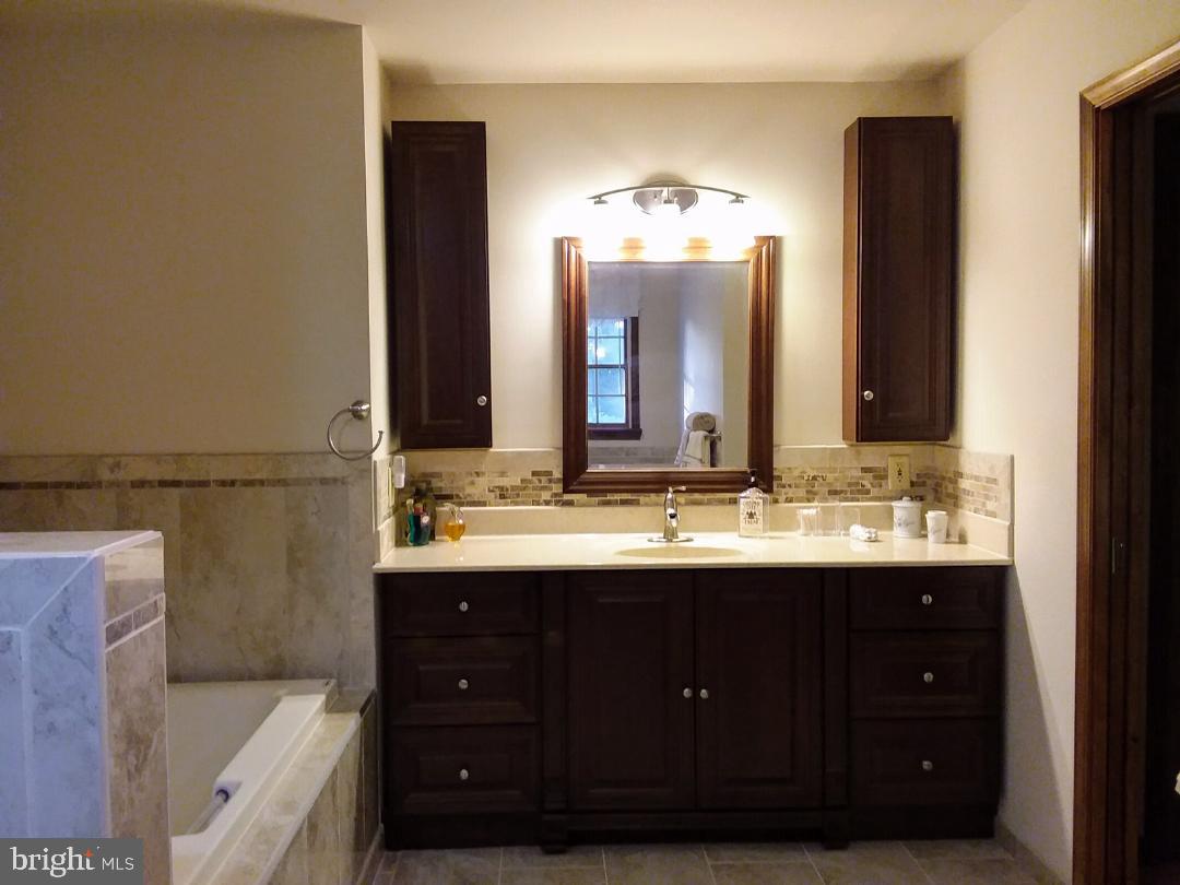 348 Eayrestown Road Southampton, NJ 08088 - Photo 21 of 32 a bathroom with a double vanity sink and a mirror
