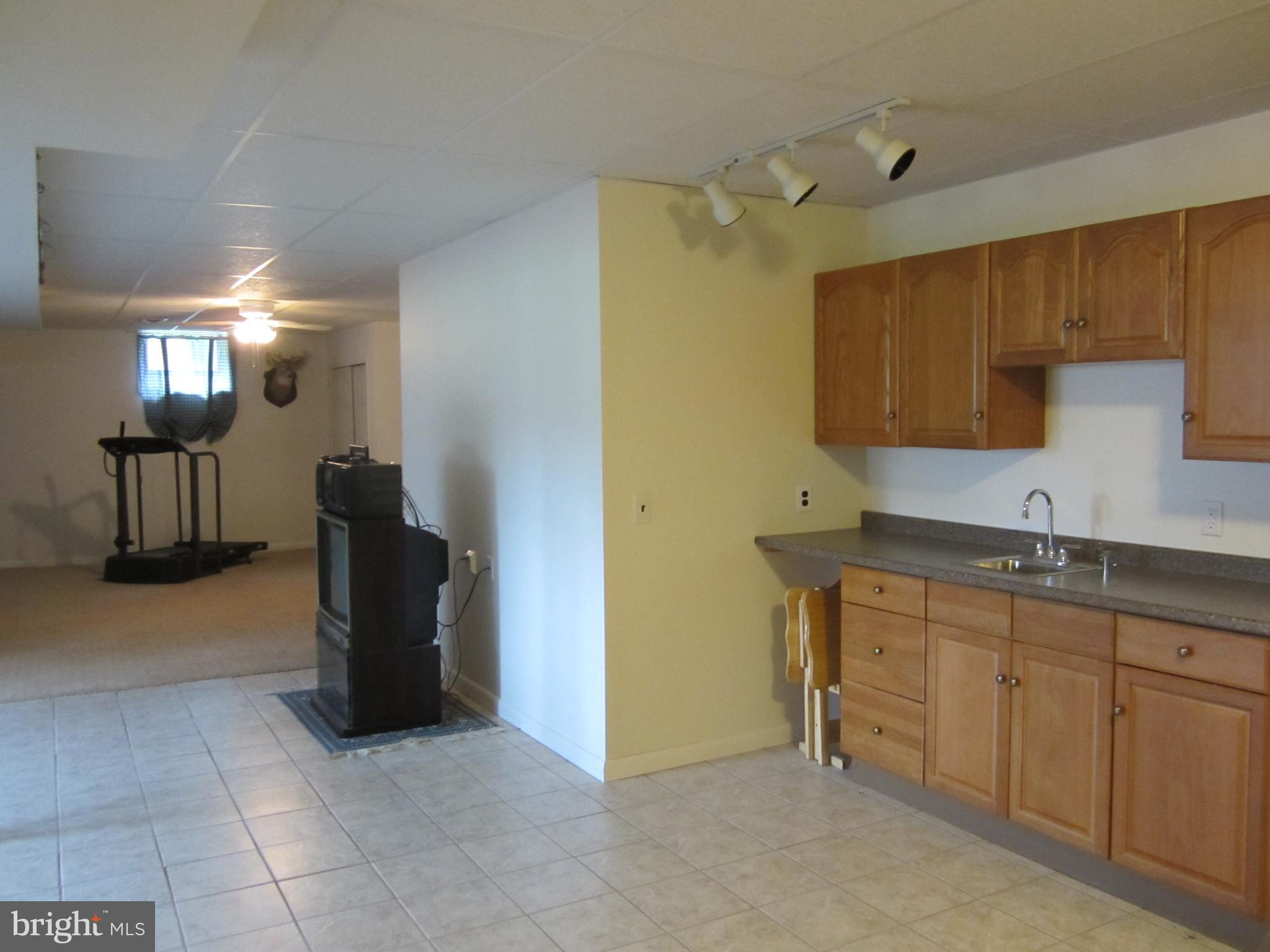 348 Eayrestown Road Southampton, NJ 08088 - Photo 23 of 32 a kitchen with a refrigerator and a sink