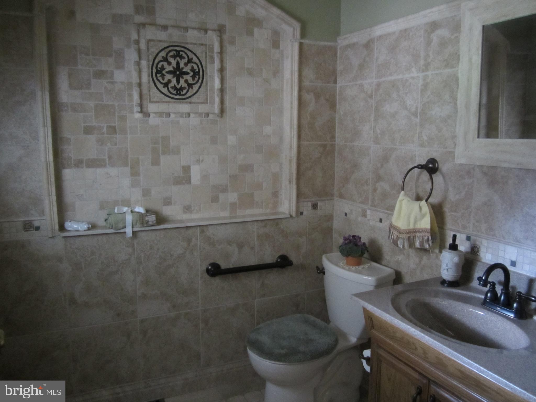 348 Eayrestown Road Southampton, NJ 08088 - Photo 4 of 32 a bathroom with a toilet and a sink