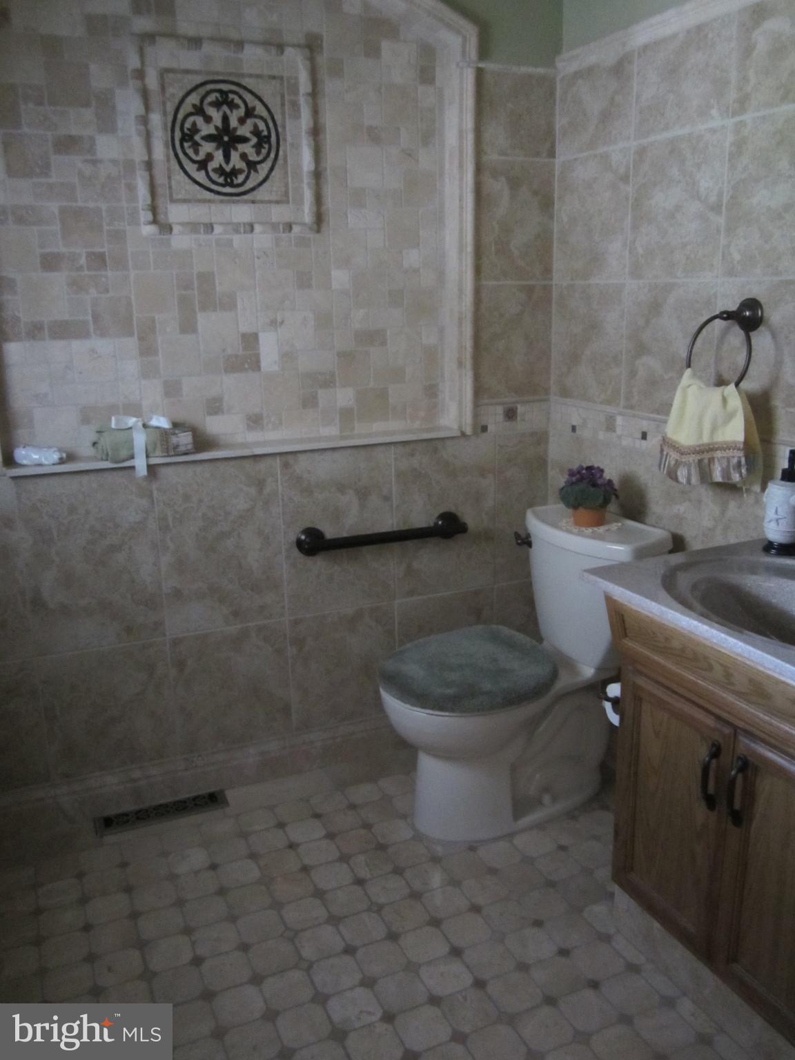 348 Eayrestown Road Southampton, NJ 08088 - Photo 5 of 32 a bathroom with a toilet and a sink