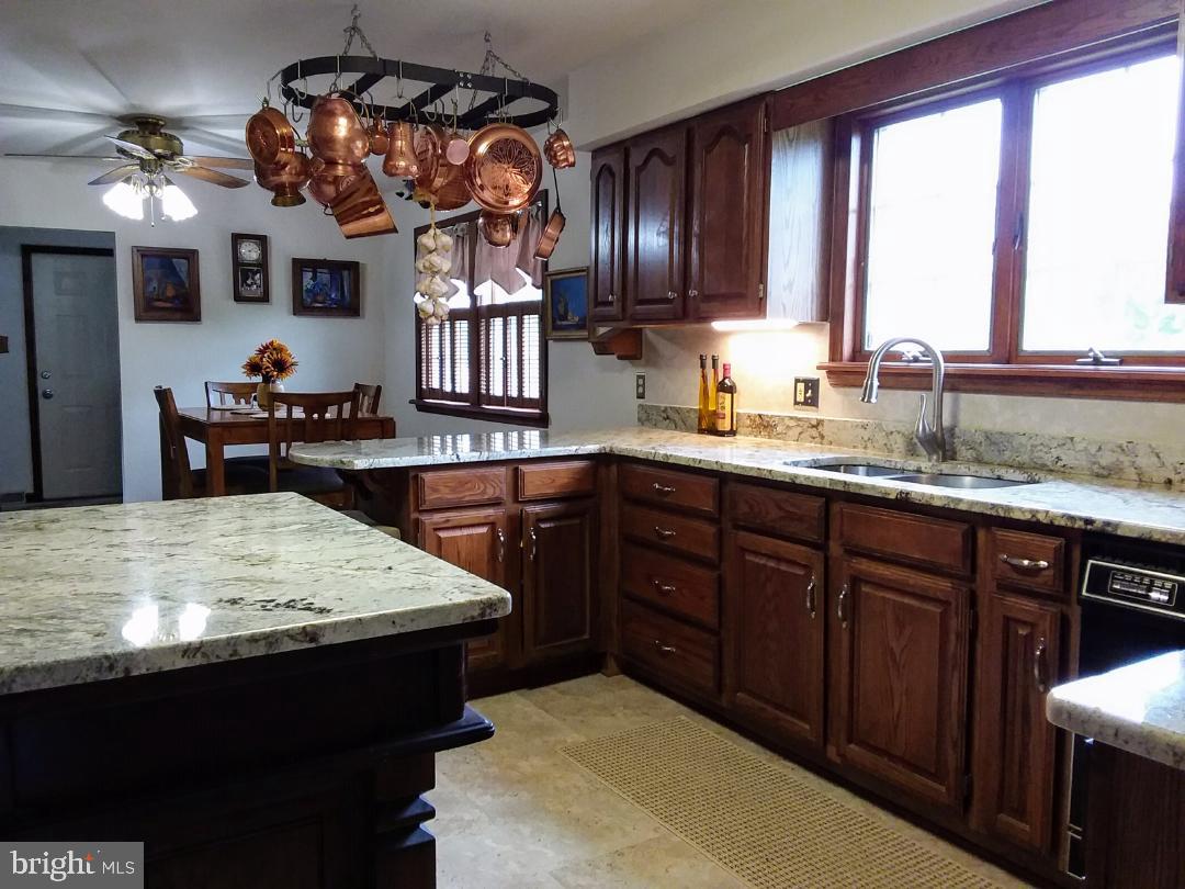 348 Eayrestown Road Southampton, NJ 08088 - Photo 7 of 32 a kitchen with a sink a stove and cabinets