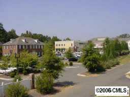 a view of a street with a building in the background