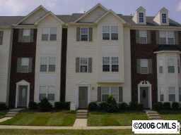 9127 Washam Potts Road, Unit 9127 Cornelius, NC 28031 - Photo 2 of 8 a front view of a house with garden