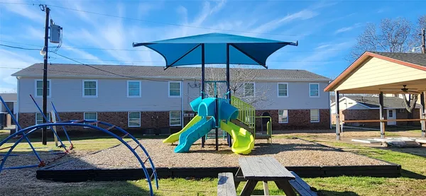 a view of a room with wooden floor and window