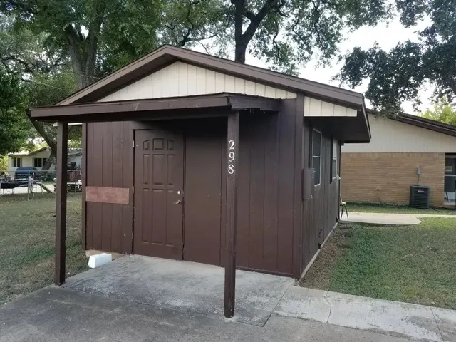 a view of a storage and utility room with a washer dryer