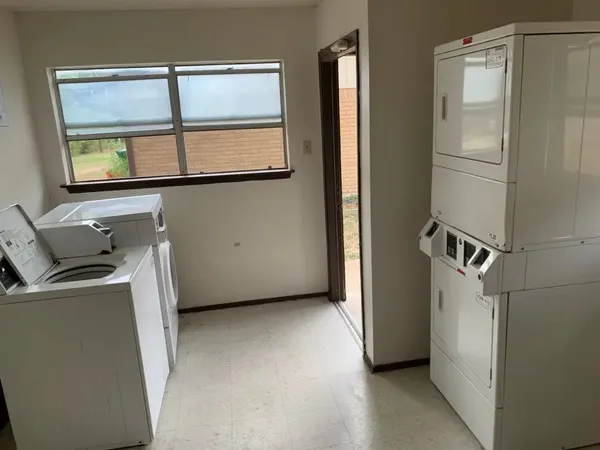 a kitchen with a refrigerator and cabinets