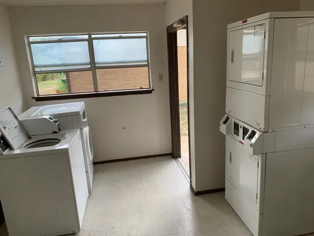 a kitchen with a refrigerator and cabinets