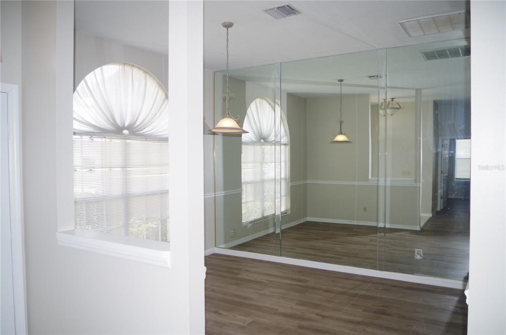 4207 Elba Place Valrico, FL 33596 - Photo 24 of 24 a view of empty room with wooden floor and fan
