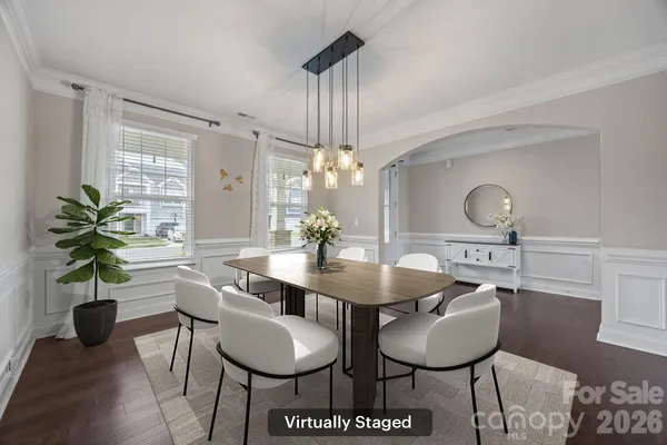 a view of a dining room with furniture and wooden floor