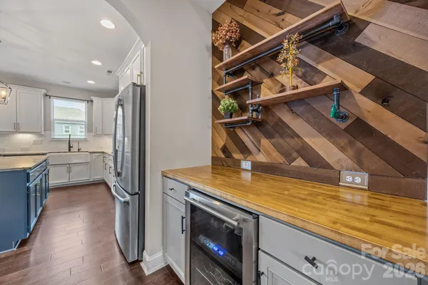 a kitchen with a sink stainless steel appliances and cabinets