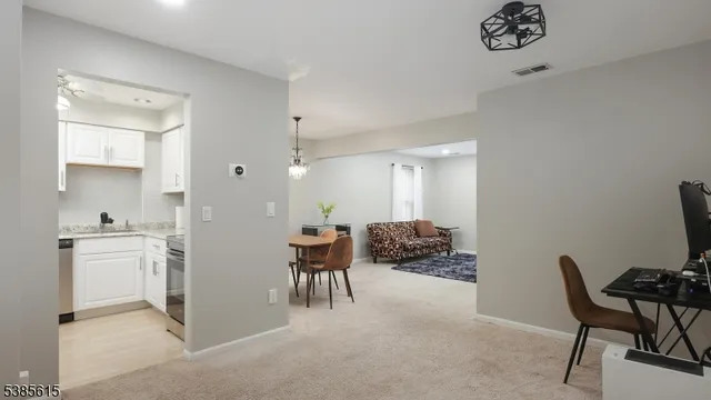 a kitchen with a table and chairs