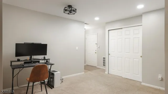 a view of a workspace with furniture