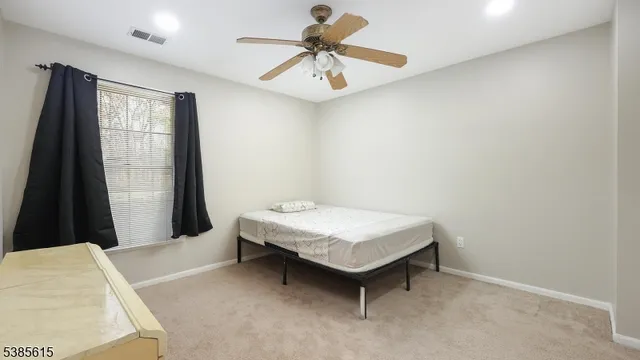 a room with a table and a chandelier