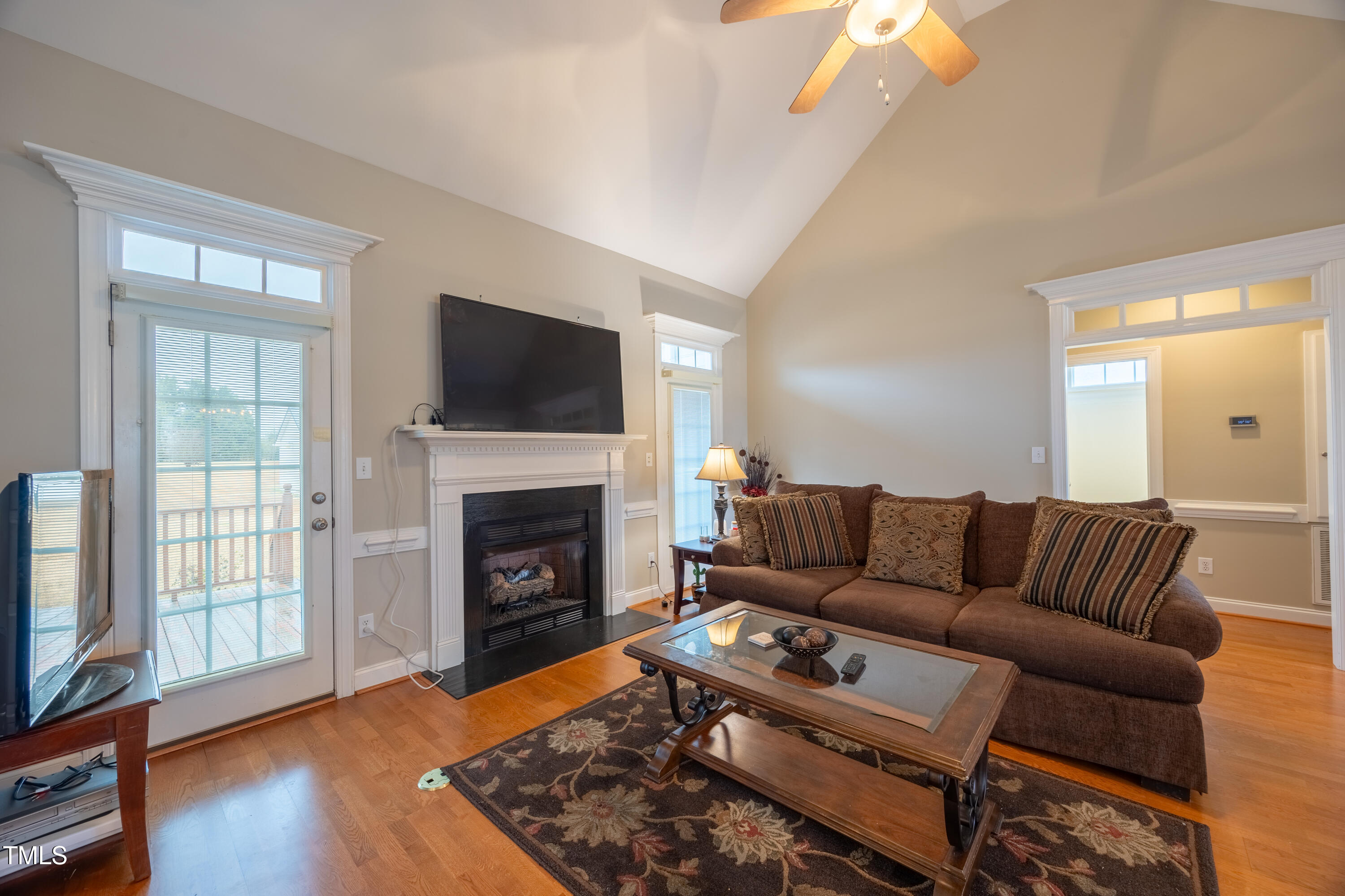 5148 Nowell Road Sims, NC 27880 - Photo 12 of 49 a living room with furniture a flat screen tv and a fireplace