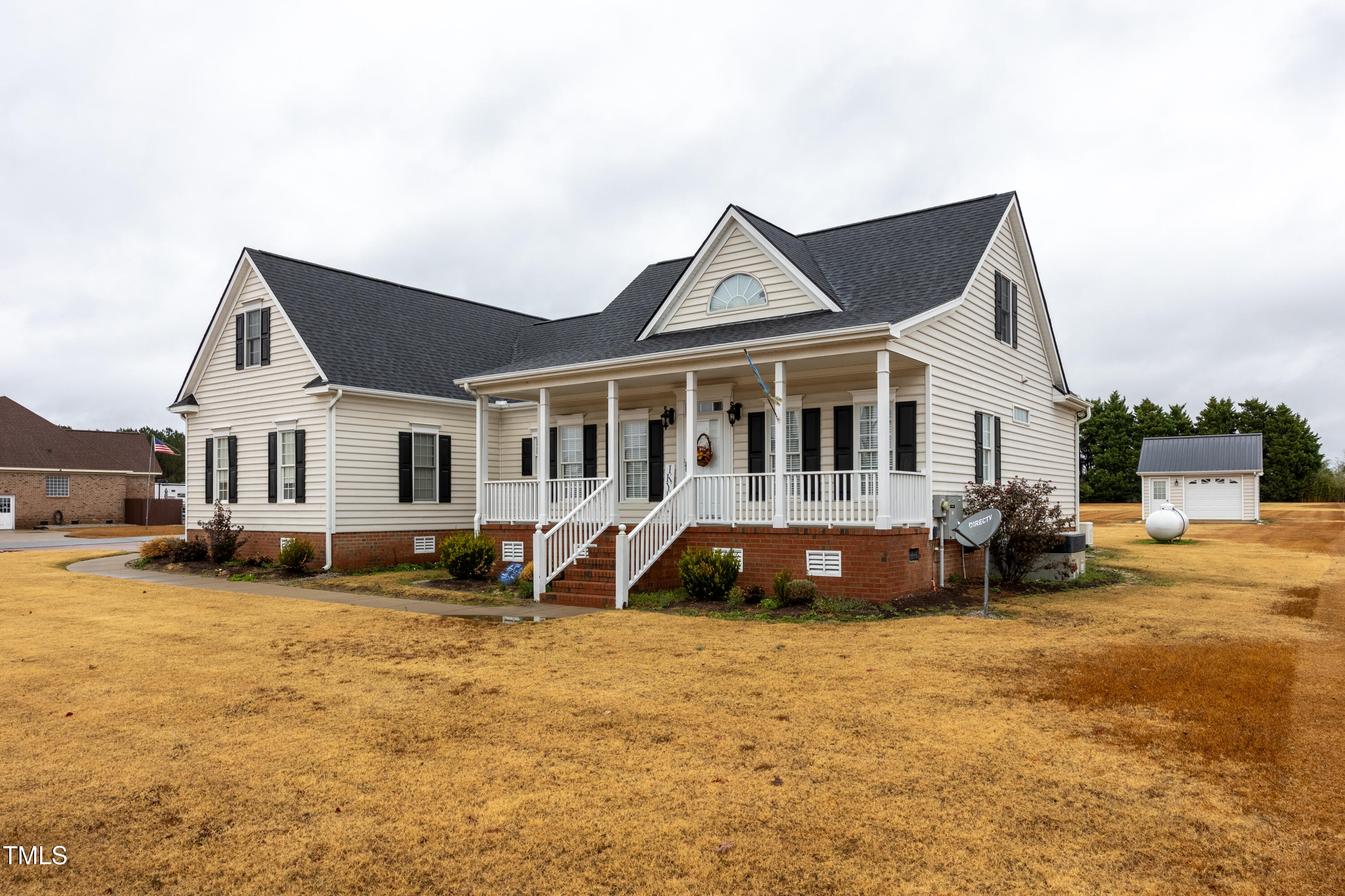 5148 Nowell Road Sims, NC 27880 - Photo 2 of 49 a view of a house with a yard and deck