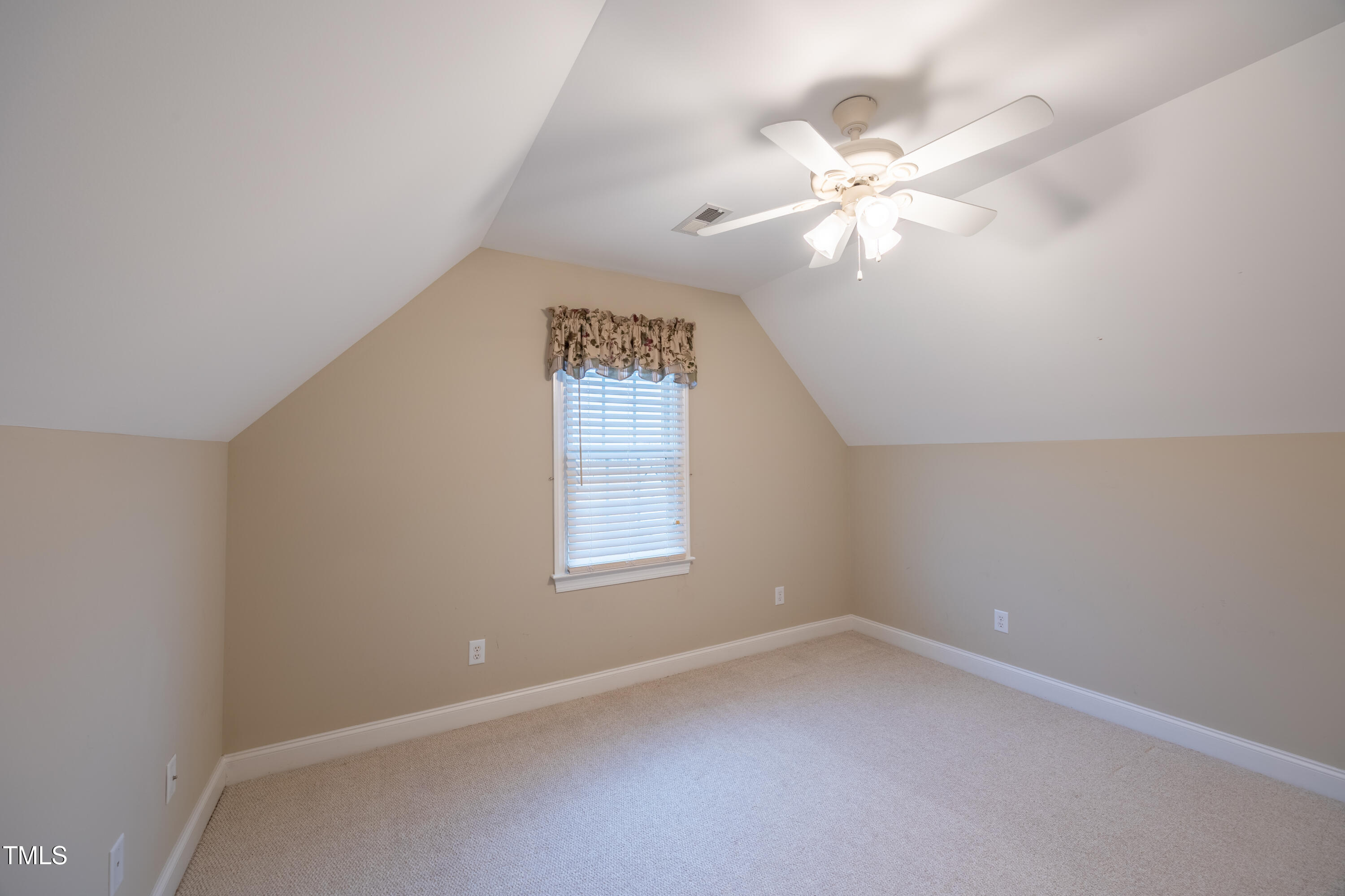 5148 Nowell Road Sims, NC 27880 - Photo 39 of 49 an empty room with a window and a fan