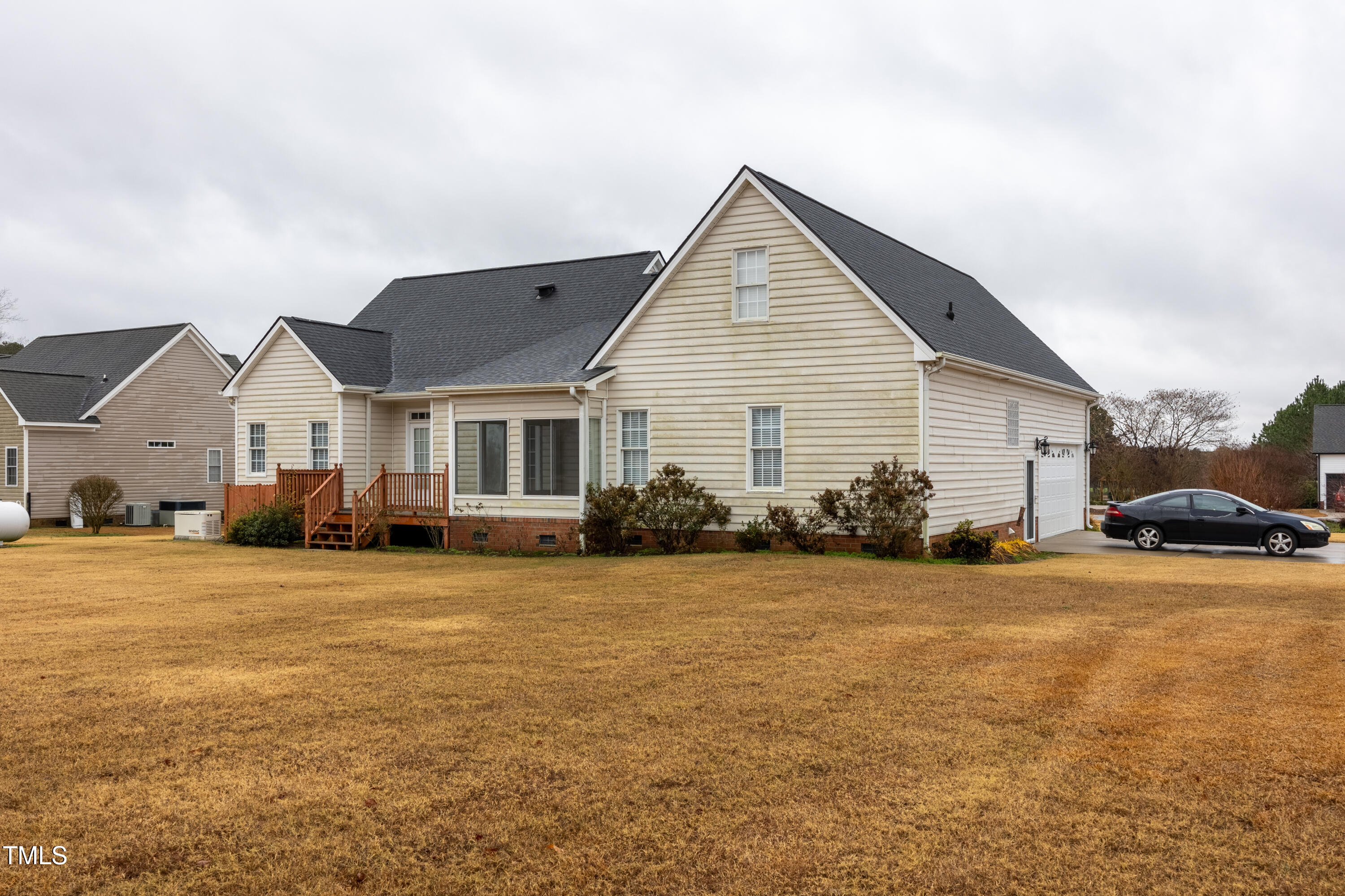 5148 Nowell Road Sims, NC 27880 - Photo 47 of 49 a view of a house with a yard and garage