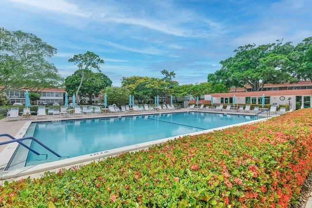 a view of swimming pool with outdoor seating and deck