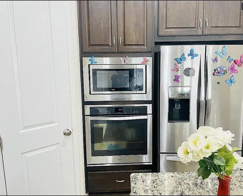 616 Garner Park Drive Georgetown, TX 78628 - Photo 15 of 26 Kitchen featuring stainless steel appliances and light stone counters