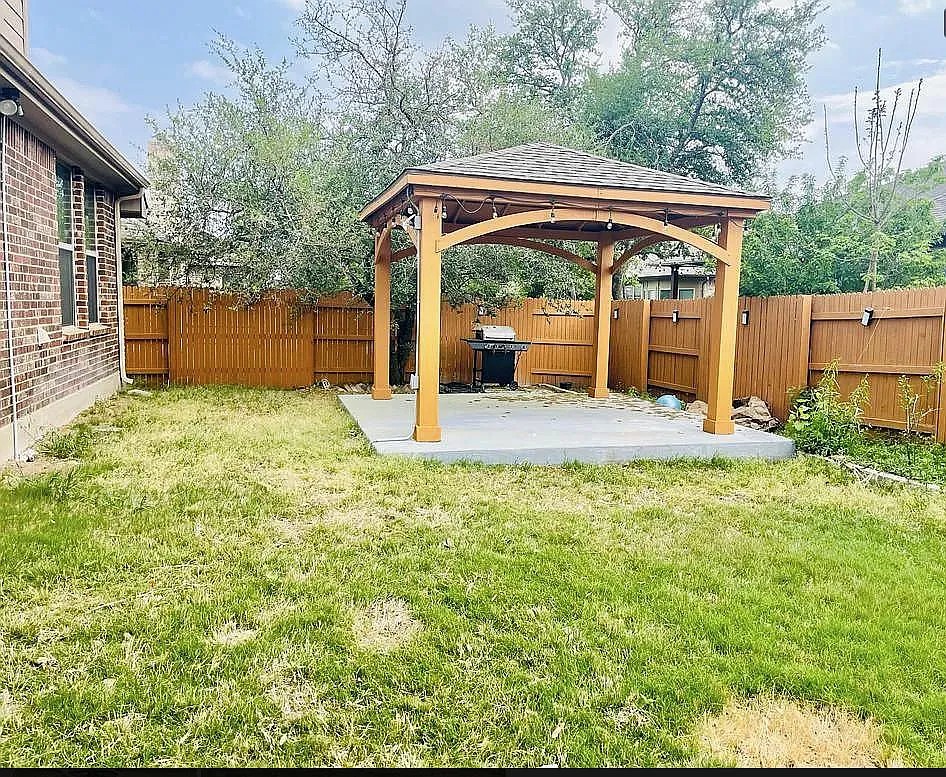 616 Garner Park Drive Georgetown, TX 78628 - Photo 16 of 26 Fenced backyard with a gazebo and a patio