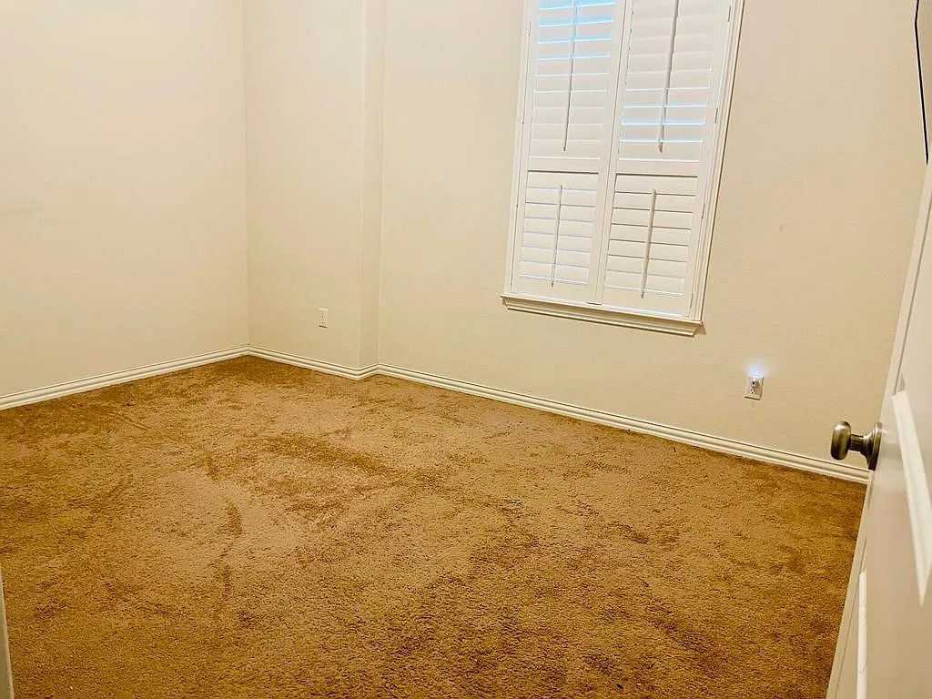 616 Garner Park Drive Georgetown, TX 78628 - Photo 17 of 26 Carpeted empty room with baseboards