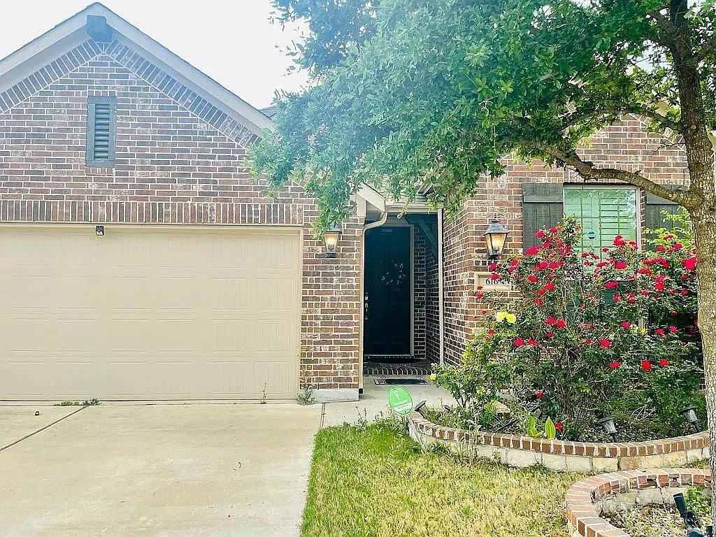 616 Garner Park Drive Georgetown, TX 78628 - Photo 22 of 26 View of front of property with brick siding and concrete driveway