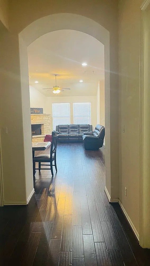 616 Garner Park Drive Georgetown, TX 78628 - Photo 24 of 26 Hallway featuring arched walkways, dark wood-type flooring, recessed lighting, and lofted ceiling