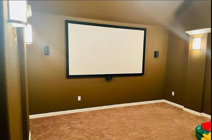 616 Garner Park Drive Georgetown, TX 78628 - Photo 8 of 26 Carpeted cinema room featuring baseboards