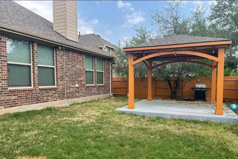 616 Garner Park Drive Georgetown, TX 78628 - Photo 9 of 26 Fenced backyard featuring a gazebo and a patio area