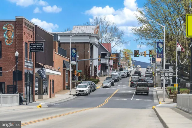 a view of a street with cars