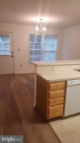 a view of walk in closet and window