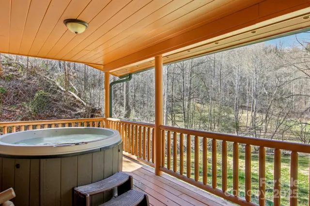 a view of balcony with a table and chairs