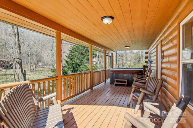 a view of balcony with wooden floor and outdoor seating