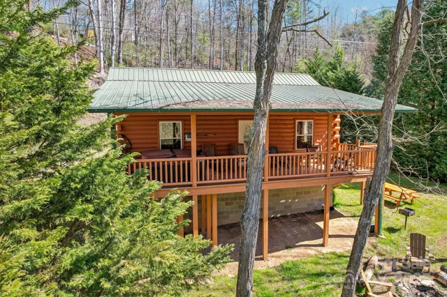 a view of a house with a window and yard