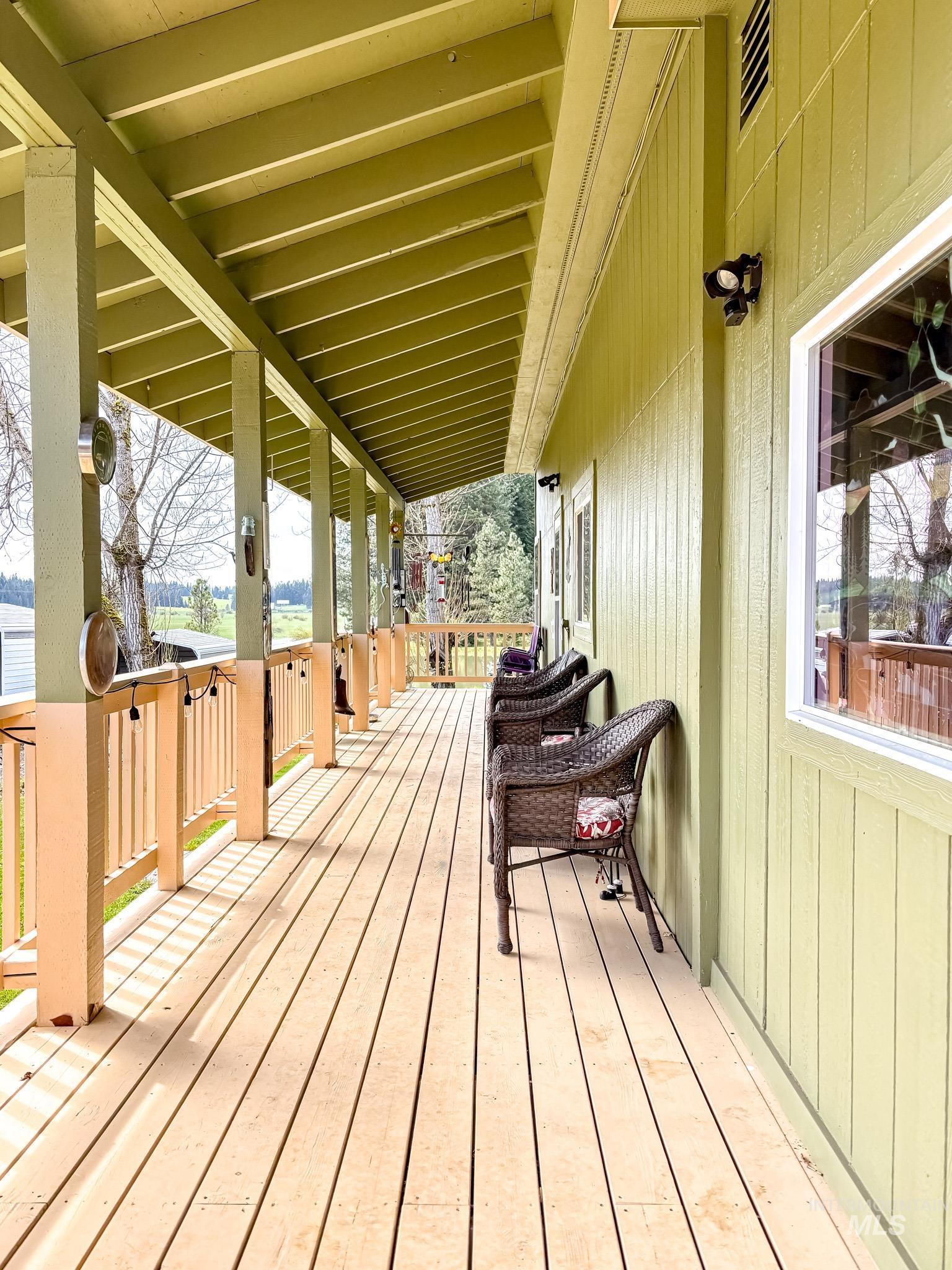 1995 Glenwood Road Kamiah, ID 83536 - Photo 4 of 38 Expansive covered porch featuring wood flooring and a painted railing system. Freshly painted