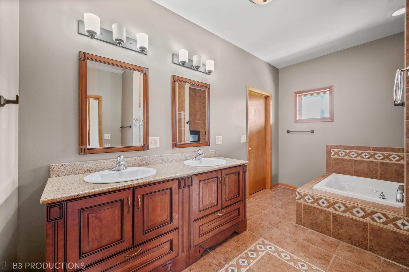 27614 South Kuersten Road Monee, IL 60449 - Photo 8 of 34 a spacious bathroom with a granite countertop sink and a mirror