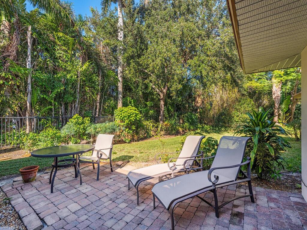 725 Pectin Road Naples, FL 34102 - Photo 3 of 13 Quiet patio to the West in rear off family room.