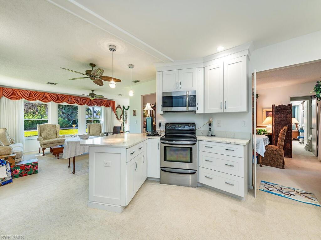 725 Pectin Road Naples, FL 34102 - Photo 6 of 13 Updated kitchen adjacent to original dining room and formal living room.