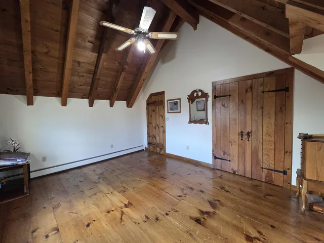 a view of a livingroom with wooden floor