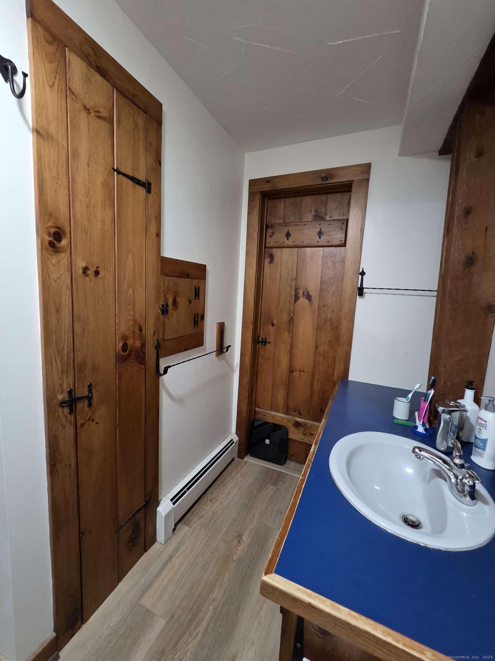 145 Perrin Road Woodstock, CT 06281 - Photo 20 of 38 a bathroom with a sink a mirror and a shower