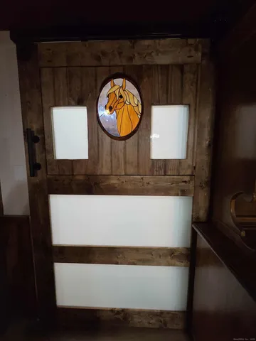 a bedroom with a bed and a walk in closet