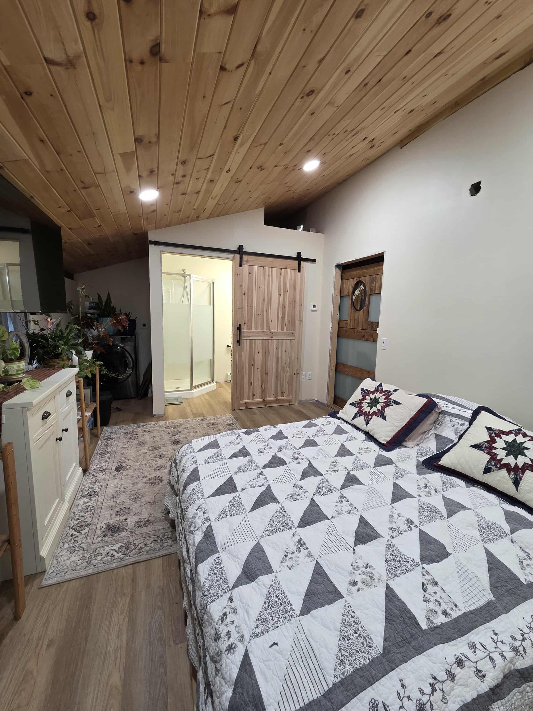 145 Perrin Road Woodstock, CT 06281 - Photo 22 of 38 a bedroom with a bed and a walk in closet