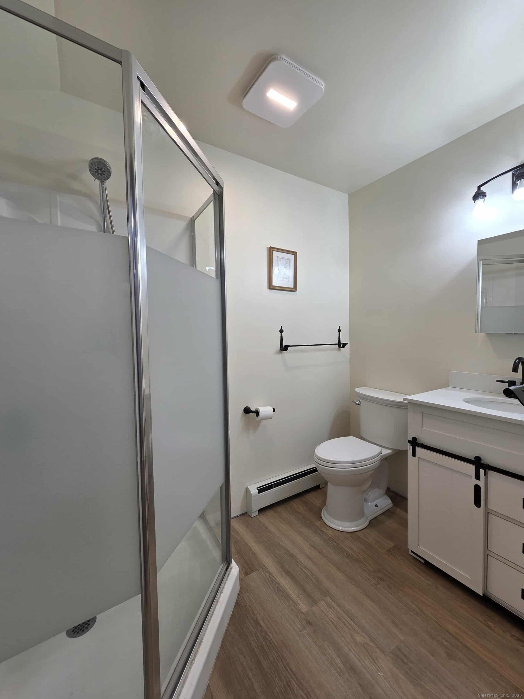 145 Perrin Road Woodstock, CT 06281 - Photo 24 of 38 a bathroom with a sink and a toilet