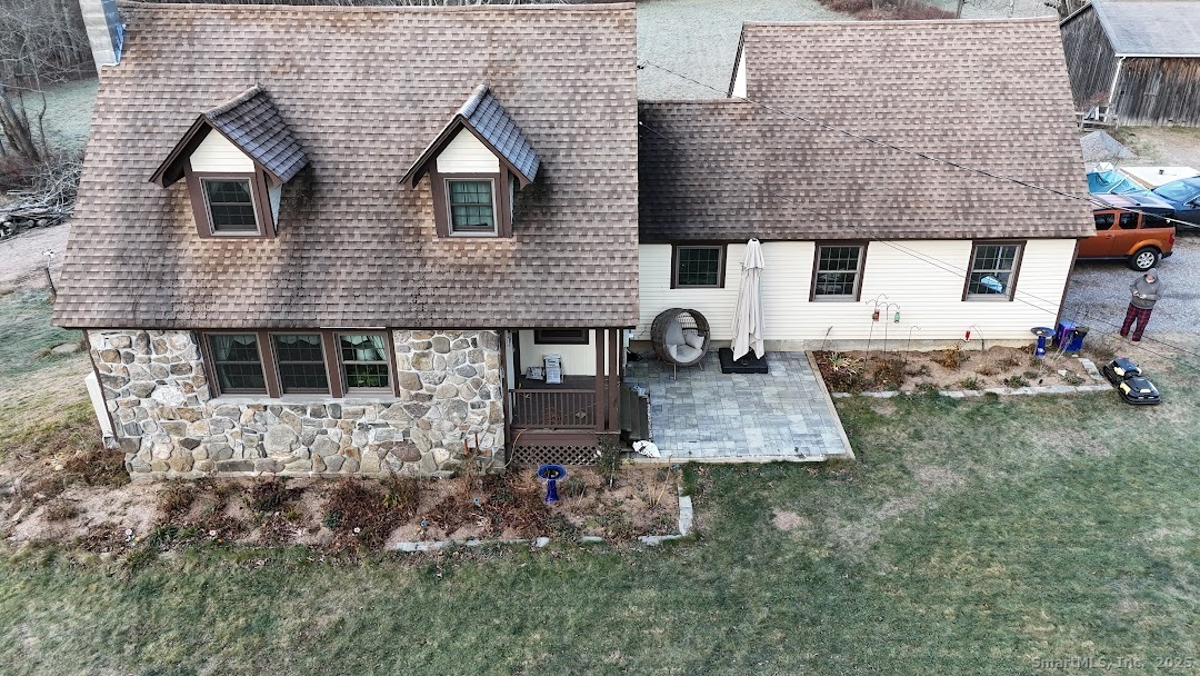 145 Perrin Road Woodstock, CT 06281 - Photo 30 of 38 a front view of a house with garden