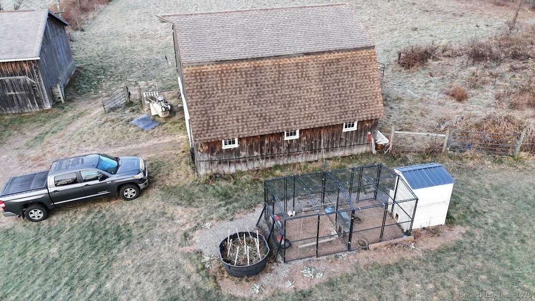 145 Perrin Road Woodstock, CT 06281 - Photo 31 of 38 a backyard of a house with table and chairs