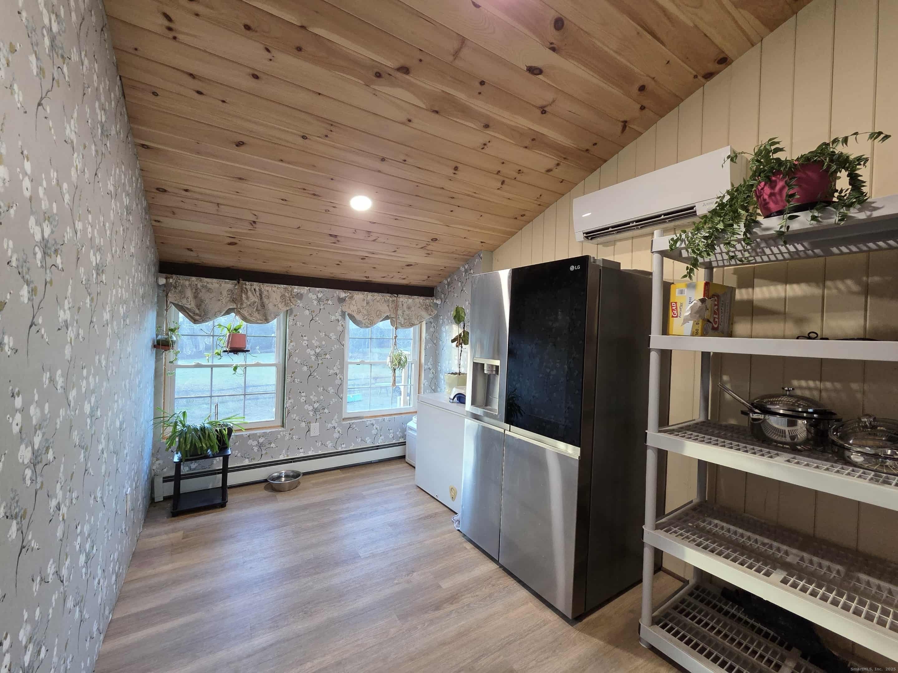 145 Perrin Road Woodstock, CT 06281 - Photo 6 of 38 a kitchen with stainless steel appliances a refrigerator and a stove