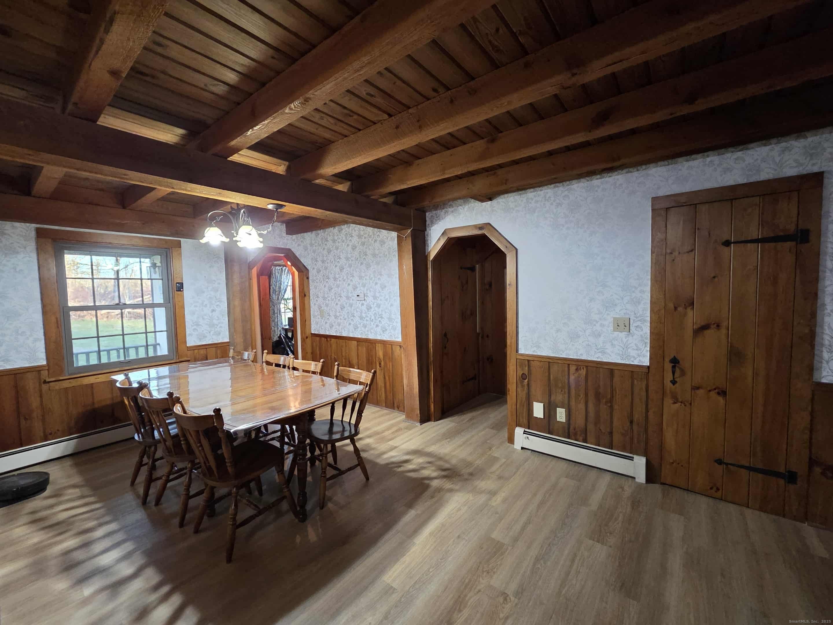 145 Perrin Road Woodstock, CT 06281 - Photo 7 of 38 a dining room with furniture window and wooden floor